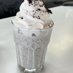 a cup of ice cream with whipped topping