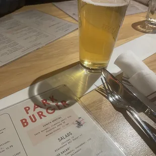 a glass of beer on a table