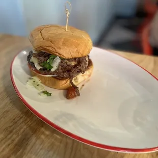 a plate with a burger on it