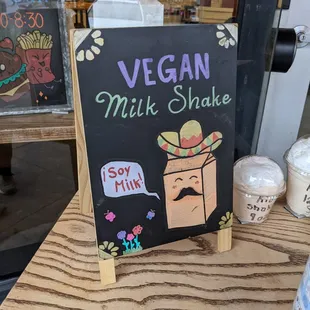 a sign for vegan milk shake