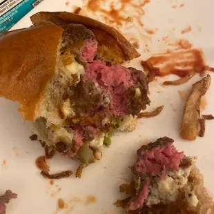 a half eaten sandwich on a plate