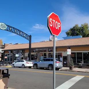 a stop sign in front of a restaurant