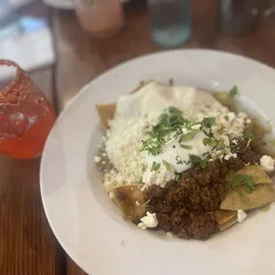 Green chilaquiles with chorizo and a spicy chamoyada cocktail.