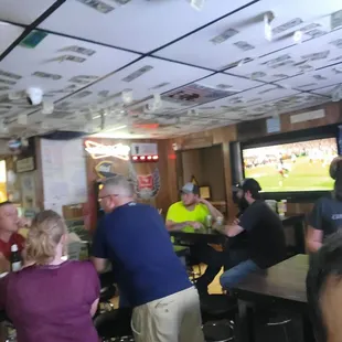 a group of people sitting at a bar