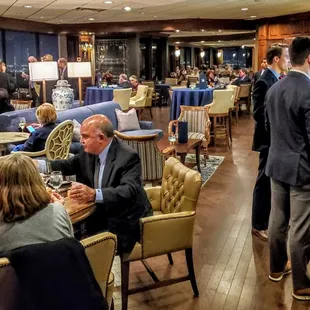 a large group of people sitting at tables
