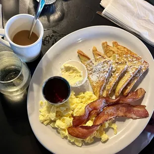 a plate of breakfast food and a cup of coffee