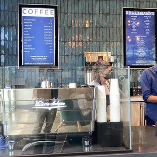 a woman working at a coffee shop