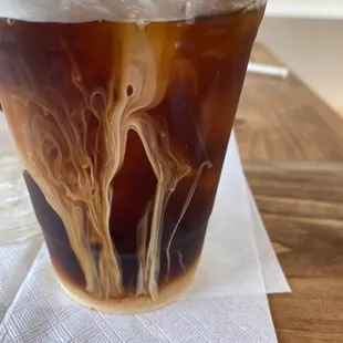 a cold beverage in a plastic cup