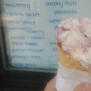 Raspberry roadrunner ice cream in a waffle cone