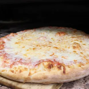 a pizza being cooked in an oven