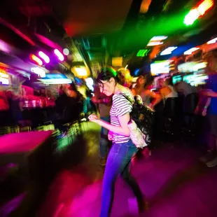 a blurry image of a woman dancing