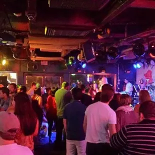 a crowd of people in a bar