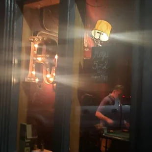 the reflection of a man in the window