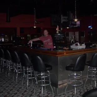 a man standing at the bar