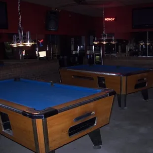 two pool tables and a bar