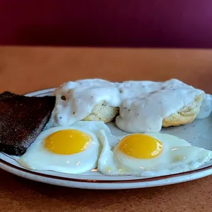 Two sunny side up eggs, gravy biscuit, and livermush, $7.95