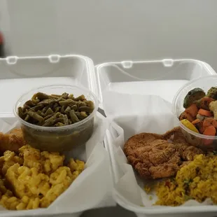 two takeout containers of food