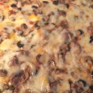 Pizza with sausage, mushroom, onion, green pepper, cheese