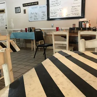a dining area with tables and chairs