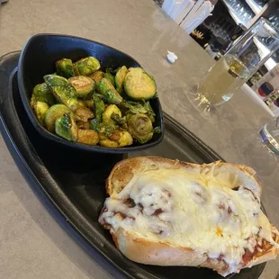 Meatball sub and Brussels. With $5 glass of champagne