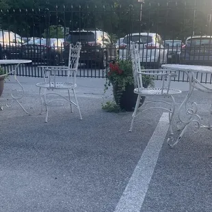 View of large parking lot from small patio area.
