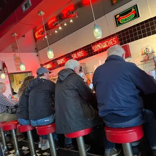 diners sitting at the bar