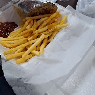 Combination shawarma which has lamb, chicken, and steak, lettuce, onion, tomato.