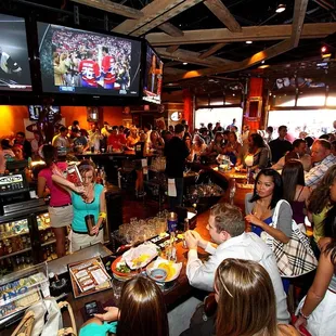 a crowd of people at a bar