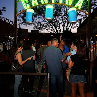 a crowd of people standing in line