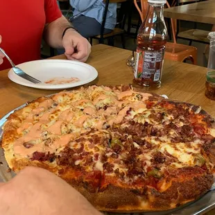 Half Ruben pizza / half Bacon and green olive. Not mine but my broworkers enjoyed it.