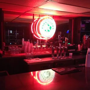 a bar with a neon sign