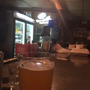 You can order to go food from the little place up the street (Cock Eyed Bob's) and they'll deliver it to the Tavern.