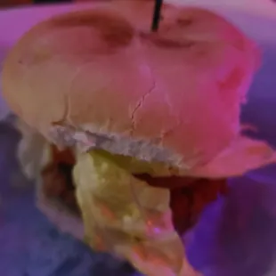 a half eaten sandwich on a plate