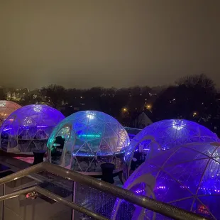 a group of domes lit up at night