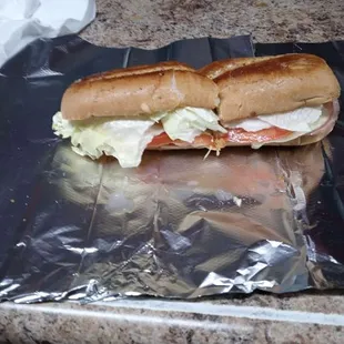 a sub sandwich on tin foil