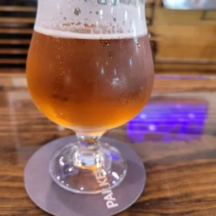 a glass of beer on a table