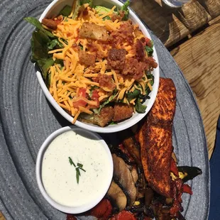 Blackened salmon with grilled veggies and side salad.
