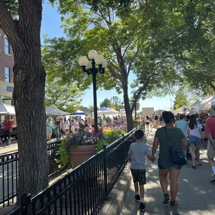 people walking down the sidewalk