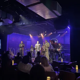 a band performing on stage