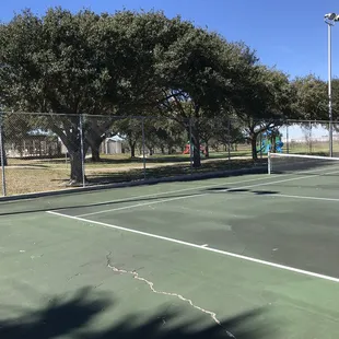Tennis courts looking at pool and playground.