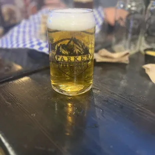 a glass of beer on a table