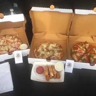 Mozzarella sticks, Hawaiian pizza, meatball special pizza and rattlesnake pizza (green chile and pepperoni)