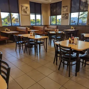 a restaurant with tables and chairs