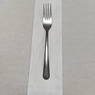 a fork on a napkin