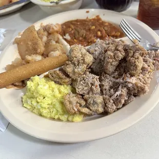 BBQ and fried oysters with sides.