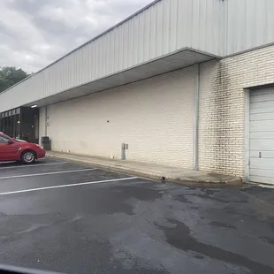 a red car in a parking lot