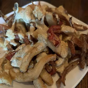 Fried calamari with onions with a delicious sauce