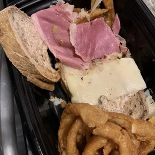 a sandwich and onion rings