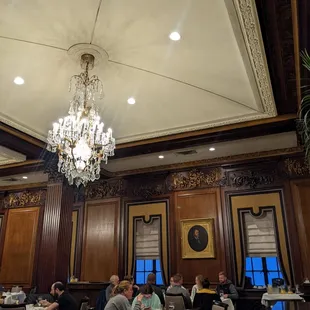 a dining room with chandelier