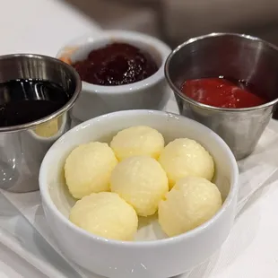 three bowls of food on a tray